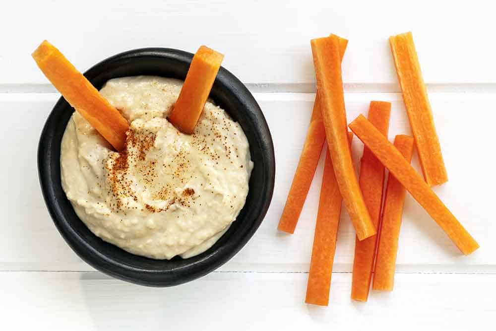 carrots and hummus optimized - Crunchy Food Cravings: Satisfy Them Without Sacrificing Your Health
