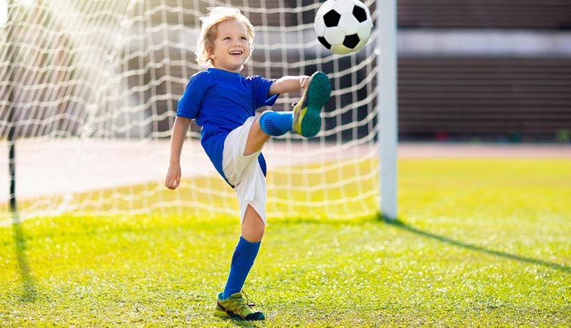 Child-playing-soccer