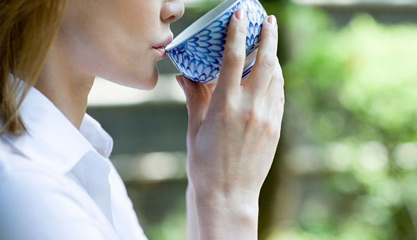 Woman-drinking-tea-01